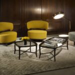 LOW TABLE JUN square and rectangular, ICOLOUNGE ARMCHAIR designed by ROBERTO LAZZERONI. Low table made in solid American walnut, with glass top: transparent, bronzed or smoked.  Armchair made in solid American walnut. Seat and back-rest in upholstered poplar plywood. Leg tips in brass.