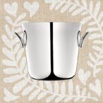 VERTIGO champagne bucket. The smaller silver plated and modern VERTIGO champagne bucket is a great gift for lovers of bubbles and people who like to entertain. Can also be used to chill white wine. VERTIGO‚Äôs bold motif - a subtly asymmetrical, thick ring often placed playfully askew - can be found on every piece in the collection designed by ANDR√âE PUTMAN. Price 720 ‚Ç¨