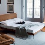 BED TALAMO BY DAMIAN WILLIAMSON 2011.THIS BED WITH MINIMAL GEOMETRIC LINES HAS BEEN DESIGNED FOR EXCEPTIONAL COMFORT. ITS ERGONOMICS AND THE CHOICE OF MATERIALS ENSURE A UNIFORM WEIGHT DISTRIBUTION OVER THE ENTIRE SURFACE AND, CONSEQUENTLY, AN EXCELLENT RELAXATION.