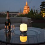 LAMPION is a LED LIGHT source that diffuses soft light through a porcelain dome, thus avoiding glare. It goes on with a touch and has three levels of light intensity. This lamp can be used indoors and outdoors to illuminate a space