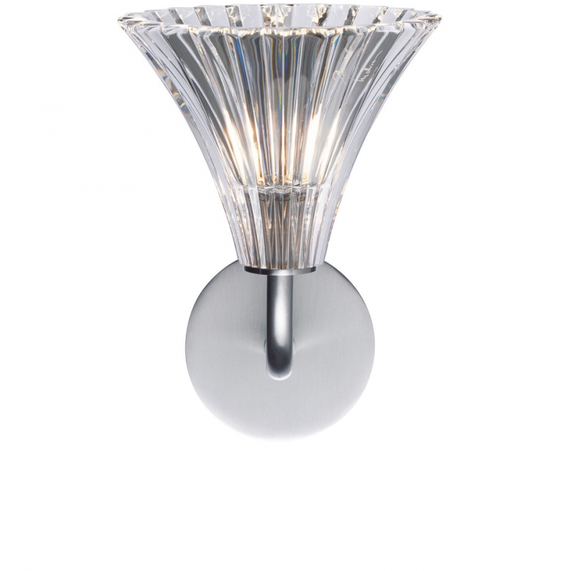 MILLE NUITS wall sconce TULIPE designed by MATHIAS. The sconce pivots 180 degrees, directing the glow anywhere between ceiling and floor, with the beveled cuts of the cup enhancing the light-scattering properties all the more. The TULIP wall sconce is available in luminous clear crystal, and Baccarat‚Äôs signature red hue. The Mille Nuits collection references the 1001 Tales of The Arabian Nights. The collection also includes other lighting fixtures (from candelabras to chandeliers), as well as bar and tableware (from champagne flutes to dessert plates).