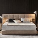 THE LAWRENCE BED PUTS A CONTEMPORARY SPIN ON THE CLASSIC UPHOLSTERED BED; BRINGING BACK BALANCED PROPORTIONS AND ADDING THE KIND OF CONSTRACTIVE DETAILS THAT SPEAK VOLUMES ABOUT MINOTTI'S ABILITY TO DESIGN AND MASTERFUL CRAFTMANSHIP. THE PADDED HEADBOARD IS DIVIDED INTO TWO SEPARETE ELEMENTS THAT COME IN TWO DIFFERENT HEIGHTS AND THREE WIDTHS; OPENING THE DOOR TO CREATIVE FREEDOM IN DESIGNING SYMMETRICAL AND ASYMMETRICAL CONFIGURATIONS AND MAKING BOLD CHOICES IN UPHOLSTERY COMBINATIONS - DESIGNE