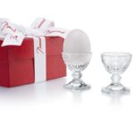 HARCOURT eggholder. True to its modernity, HARCOURT, the king of glasses, becomes an egg holder. A small object of desire to give your eggs allure and delight design fans. So chic! Price ‚Ç¨150