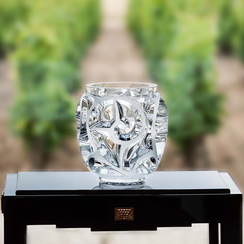 TOURBILLONS  vase designed by  REN√â LALIQUE.  In 1926 Rene Lalique created the Tourbillons Vase. Inspired by movement of the fern blossom, its abstract design allows for the utmost freedom of interpretation. Graphic and poetic, its curves stunningly follow the rhythm of light, drawing the eye into swirls of crystal.