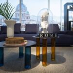 SMALL TABLE ECHINO BY SEBASTIAN HERKNER 2019, SMALL TABLES ARE THREE-LAYERED BLOWN GLASS LEGS IN THE SHADES SMOKY GREY, LIGHT- BLUE, AMBER OR BLUE. STEEL SHEET TOP, 4 MM THICK, WITH EITHER NATURAL OR BLACK NICKEL-SATIN FINISH OR MIRROR TOP, 5 MM THICK.