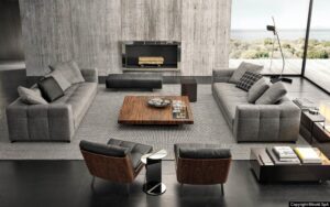BLAZER seating system by RODOLFO DORDONI, designed in 2020. All the surfaces of the elements feature stitching, designing evenly-spaced bands on the covering of the base, cushions, armrests and backrest, and creating a quilting effect that identifies its look and instantly provides a sensation of comfort.