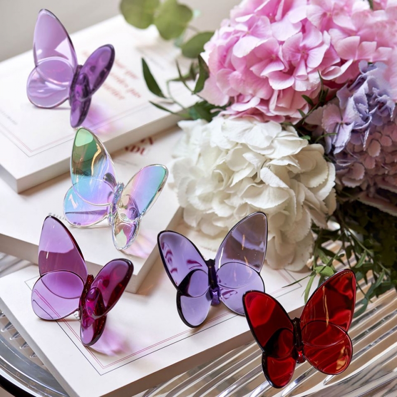 PAPILLON LUCKY BUTTERFLY. Poised to flutter off, the Baccarat crystal butterfly glints vibrantly with bright color. The wings fan out grandly, echoing the shape characteristic of the Amazonian breed.