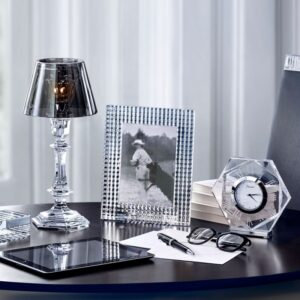 EYE photo frame. Memorable moments : framed. Picture frames with the amazing cuts of EYE Collection : horizontal cuts on the front, vertical at the back creating dazzling effects.  One Lacquered in red, Baccarat‚Äôs signature & others in crystal clear and blue. A subtle and invisible way to place the picture through a transparent sheet. The frame are hand-cut and designed by NICOLAS TRIBOULOT , the designer of the EYE collection. P