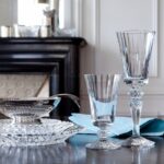 Designed by MATHIAS for Baccarat, the name MILLE NUITS is a reference to the 1001 Tales of The Arabian Nights, and to the world of the Orient. The signature of the MILLE NUITS set is the elegant diamond-cut center, which sits just between the bowl and the top of the stem. The MILLE NUITS collection is also comprised of champagne flutes available in a variety of vivid colors. Within tableware, the MILLE NUITS collection extends to decanters and plates. Within the home d√©cor category, the collection extends to chandeliers, lamps, candelabras.