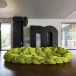 BOA by FERNANDO E HUMBERTO CAMPANA. Boa is a large woven nest. An enveloping hug. An invitation to explore different positions by lying down between its cushions.