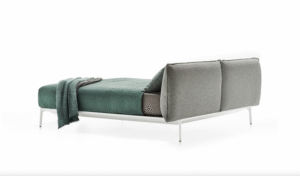 YALE BED by JEAN-MARIE MASSAUD. Structure in extruded aluminium, die-cast legs in aluminium. The structure is painted matt in the colours white, bronze and black nickel.  The upholstery in fabric or leather covers every part of the headboard and is completely removable. These contrasting seams characterise and identify the YALE Bed collection, only for the high headboard variant. Available in the colours white, medium grey and anthracite, which can be selected and  combined by the client.