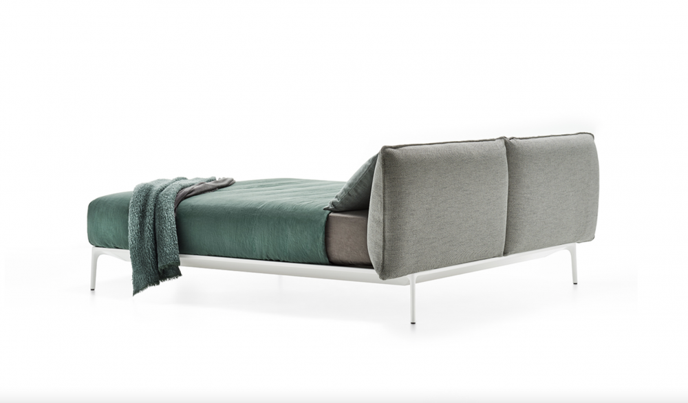 YALE BED by JEAN-MARIE MASSAUD. Structure in extruded aluminium, die-cast legs in aluminium. The structure is painted matt in the colours white, bronze and black nickel.  The upholstery in fabric or leather covers every part of the headboard and is completely removable. These contrasting seams characterise and identify the YALE Bed collection, only for the high headboard variant. Available in the colours white, medium grey and anthracite, which can be selected and  combined by the client.