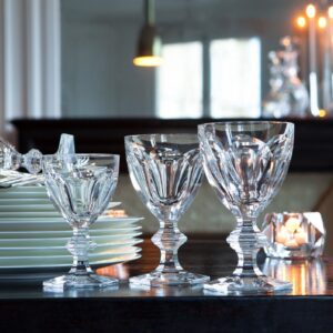 The HARCOURT 1841 collection, the oldest in the Baccarat archive, is reputed for its iconic design. Created in 1841, HARCOURT stemware has been chosen by historical icons. The HARCOURT 1841 collection has also been a staple of French power, selected since the age of Napoleon III to its contemporary use in the Palais de l‚Äô√âlys√©e. The HARCOURT 1841 glass is characterized by its architectural form: a stunning shape from the flat cut pattern of the bowl to the beveled geometry of the stem down to the hexagonal foot. Its craftsmanship is apparent from every angle of its regal and graceful form. Sipping from a HARCOURT 1841 glass is taking part in the brand‚Äôs storied and elegant past.