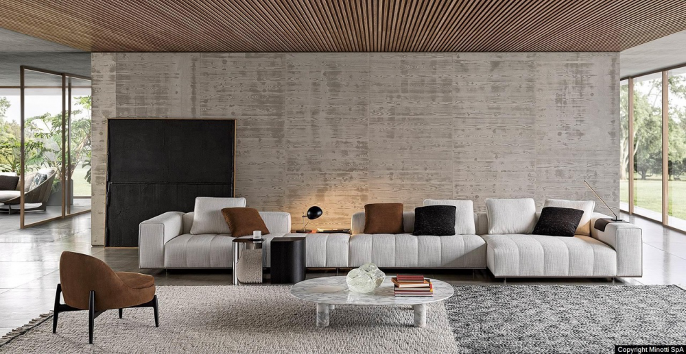 GOODMAN modular seating system by RODOLFO DORDONI , designed 2022.The system is suspended from the floor on refined Bronze or Polished Chrome metal feet, set back from the edge, and a perimeter frame that matches the same finishes; the optical effect of suspension in Goodman enhances the softness of the seat, offering a super-comfortable welcome. The volume of the one-piece seat is particularly ergonomic and comfortable thanks to the use of the innovative technology used: the system of pocket springs is combined with a layer of polyurethane padding in layered densities that give a consistent sensation of softness and cosiness.