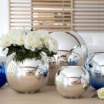 Rounded UNI vase is made with double sided metallized glass with silver