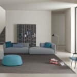 COSY by FRANCESCO ROTA, designed in 2017. COSY comes from the idea to offer high comfort with a reassuring, warm and familiar gesture. The timeless lines, soft and all-embracing design, adaptability and versatile character make COSY a padded item that offers the utmost comfort in a wide range of situations, environments and frameworks. Collection of padded modular elements featuring seats with different depths and lengths; backs with different heights, either aligned or corner compositions; coffee tables and additional cushions. A highly versatile system designed for consumers to choose their favourite composition that will meet their needs and blend into any setting, environment, style and taste.