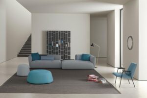 COSY by FRANCESCO ROTA, designed in 2017. COSY comes from the idea to offer high comfort with a reassuring, warm and familiar gesture. The timeless lines, soft and all-embracing design, adaptability and versatile character make COSY a padded item that offers the utmost comfort in a wide range of situations, environments and frameworks. Collection of padded modular elements featuring seats with different depths and lengths; backs with different heights, either aligned or corner compositions; coffee tables and additional cushions. A highly versatile system designed for consumers to choose their favourite composition that will meet their needs and blend into any setting, environment, style and taste.