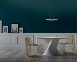 S TABLE by XAVIER LUST, designed in 2019. A sound that reminds a shape, a name that speaks for itself: S TABLE, in which the liquid consonant perfectly tells about the twisted S-shaped stand of this table designed by XAVIER LUST. The creations of award-winning designer actually stand out for the visible tension he gives to his objects, featuring curves inspired by the (de)formation process of metallic surfaces that identifies his whole creative path. The stand, moulded either in Ceramilux or in Cristalplant, technologically advanced, hypoallergenic and non-toxic material, can be crowned by different types of top ‚Äì in crystal, in wood fiber, marble or in in Cristalplant ‚Äì to further customise an already unique object.