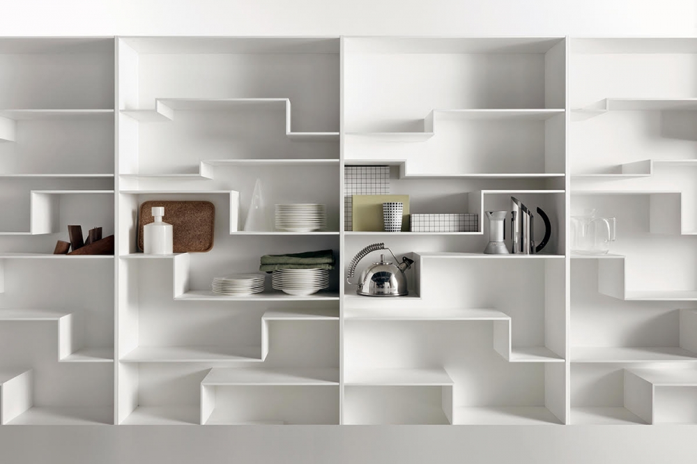 MELODY by NEULAND INDUSTRIEDESIGN, designed in 2008. An individual flexible and customised furnishing solution, not just a simple bookcase. This is MELODY‚Äôs visiting card, offering a comfortable and eye-catching horizontal storage, also for big objects. The layout of the shelves with its gritty graphic pattern, sends an idea of movement, a sort of discreet waving. Functionality and modularity have always been key features for the designer duo NEULAND INDUSTRIEDESIGN, together with a catchy and innovative design. In this case the module is single, but always vertically revertible, which allows to give horizontal continuity or discontinuity to the shelves, by combining more modules. Offered either in a monochromatic version or with contrast backrest, Melody can be modified in time and space, for unique environments.