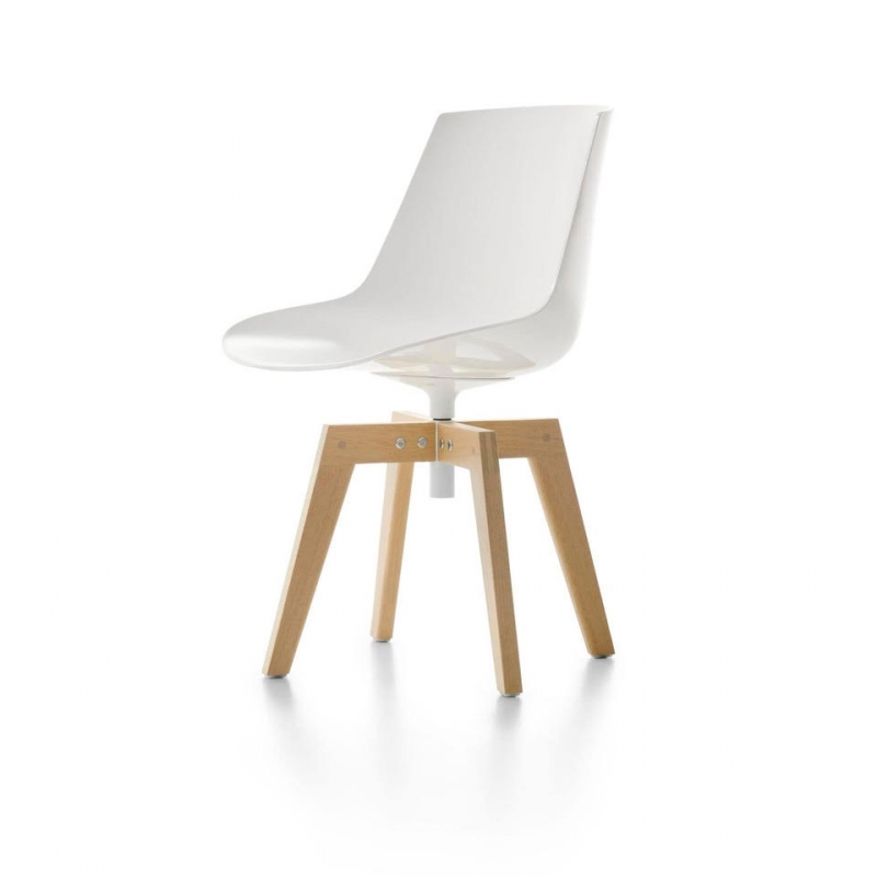 FLOW IROKO indoor and outdoor chair by JEAN-MARIE MASSAUD, designed in 2020. FLOW, icon of MDF Italia collection, renews itself and, thanks to the Iroko wooden base, it is also suitable for outdoor spaces. FLOW chair IROKO also meets the various design needs for contract, hospitality, and restaurant business. The swivel 4-legged base, is made of solid IROKO, a very dense African wood, highly resistant to bad weather, light and extremes of temperature. A characteristic of thus wood is its smooth, even surface. All parts made of IROKO are treated using an exclusive varnish, specifically for outdoor use.