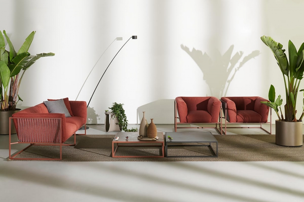 ARPA INDOOR and OUTDOOR SOFA, ARMCHAIR and SIDE TABLE by RAM√ìN ESTEVE, designed in 2020. As its name implies, ARPA Collection is inspired by the harp, one of the most beautiful and mesmerizing musical instruments. Unlike the meticulous work involved in manufacturing a harp, in designing this collection, rigorous paring down was applied, resolving each piece with the least possible number of elements. ARPA collection combines the stability of the orthogonal external shape with the softness and comfort of the inner cushion shell. The thin strings add elegance and fineness to every piece, giving a special sense of lightness, as if the whole cushion mass was hanging from the structure.  Designed to be timeless, ARPA aims to become an icon, not only for aesthetical reasons, but also for its functionality and comfort.