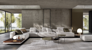 HORIZONTE modular seating system by MARCIO KOGAN / STUDIO MK 27. Perfectly consistent with MARCIO KOGAN's design philosophy, the HORIZONTE modular seating system is the result of a clear architectural vision: a rigorous shape, raised seven centimetres off the ground thanks to a recessed plinth in matt black varnished metal, which gives the sofa a special feeling of suspension. A platform on which the upholstered elements are located  - seats, backrests and armrests - all conceived as large cushions with bold proportions and a strong personality.
