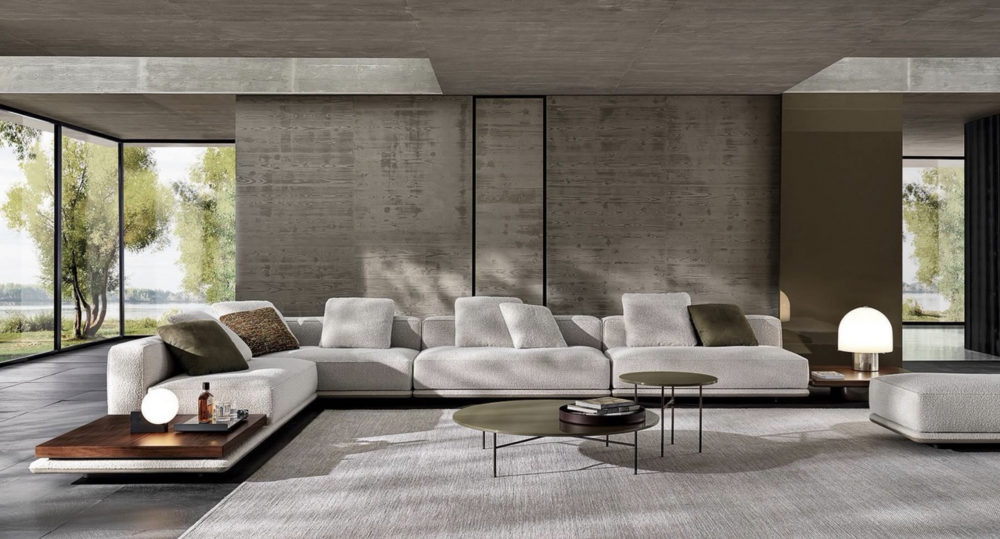 HORIZONTE modular seating system by MARCIO KOGAN / STUDIO MK 27. Perfectly consistent with MARCIO KOGAN's design philosophy, the HORIZONTE modular seating system is the result of a clear architectural vision: a rigorous shape, raised seven centimetres off the ground thanks to a recessed plinth in matt black varnished metal, which gives the sofa a special feeling of suspension. A platform on which the upholstered elements are located  - seats, backrests and armrests - all conceived as large cushions with bold proportions and a strong personality.