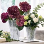 The wavy design of the crystal EYE vase comes from an extraordinary technique: exterior horizontal cuts and interior vertical cuts combine to produce a magic visual effect.