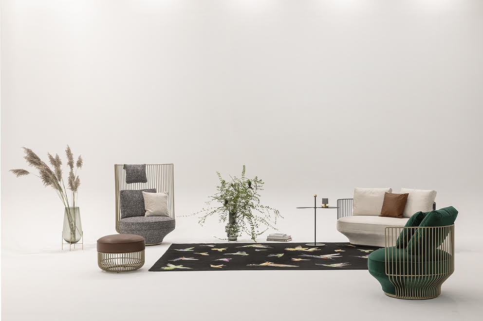 PARADISE BIRD SOFA by LUCA NICHETTO, designed in 2020. PARADISE BIRD is a collection of unusual pieces of furniture: it manifests an attitude to life, an exciting interplay of freedom and retreat, openness and reassurance. In balance between shape and essence, through a bold design that merges elegance and flexibility, PARADISE BIRD is rooted into the Viennese tradition of sophistication. The family composed of a lounge chair, a high back chair, a two-seater sofa and a stool transcribes the eclecticism of a research that aims to enhance the comfort. The special seating experience may be a surprise in view of the idiosyncratic shapes, but pocket springs and down filling deliver the kind of seating comfort associated with a genuine WITTMANN.