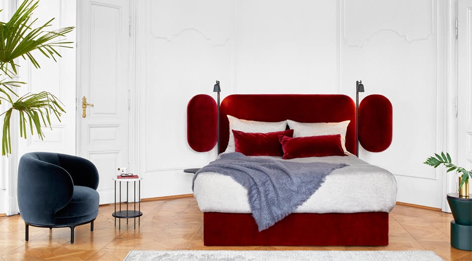 WINGS BED by JAIME HAYON, Sweet dreams come easily on wings‚Ä¶ The tiltable side wings of the WINGS BED are at the heart of an interplay between intimacy and openness. They cradle the person sleeping like a cocoon, or open up to transform the bedroom into a place where people wish to spend time ‚Äì and not just at night. Leather covered nightstands and adjustable LED reading spotlights are carried by a slender, textured powder coated frame finished in black.