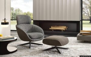 RUSSELL swivel berg√®re and cross base footstool by RODOLFO DORDONI
