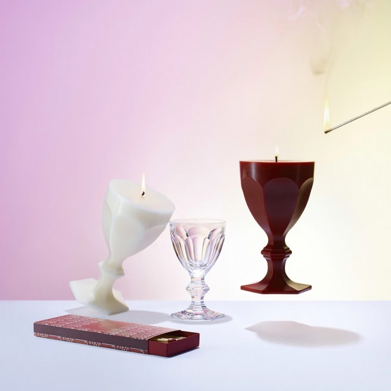 HARCOURT GLASS CANDLE.Inspired by BACCARAT'S most iconic creation, the HARCOURT GLASS CANDLE is a sculptural candle reinventing, entirely in wax, the original HARCOURT GLASS, which was first created in 1841. Known as the glass of princes and greats, it was commissioned by Emperor Napoleon III and has since adorned the world's most prestigious tables. Recognizable by its unique silhouette, six facets, and hexagonal base, it has been reinterpreted by some of the greatest designers. Available in a palette of bright, elegant colors, the collection captures the very essence of HARCOURT: a symbol of joie de vivre, boldness, and passion, remaining true to its history while always astonishing.