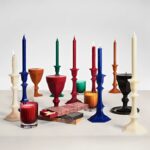 HARCOURT CANDLESTICK CANDLE. Inspired by BACCARAT'S most iconic creation, the HARCOURT CANDLESTICK CANDLE IS a graphic candle reinventing the original HARCOURT CANDLESTICK entirely in wax. Known as the collection of princes and greats, HARCOURT has adorned the world's most prestigious tables since 1841. Recognizable by its silhouette and light-catching facets, the HARCOURT CANDLESTICK CANDLE REVISITS its heritage with daring creativity. Available in a palette of bright, elegant colors, the collection captures the very essence of HARCOURT: a symbol of joie de vivre, boldness, and passion, remaining true to its history while always astonishing.